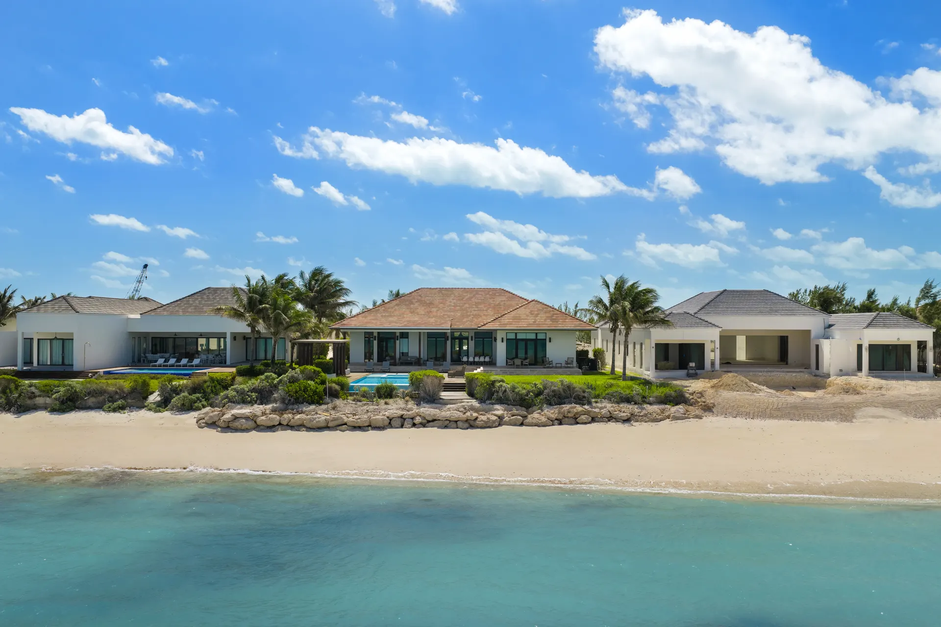 Aerial of beachfront homes on the coast