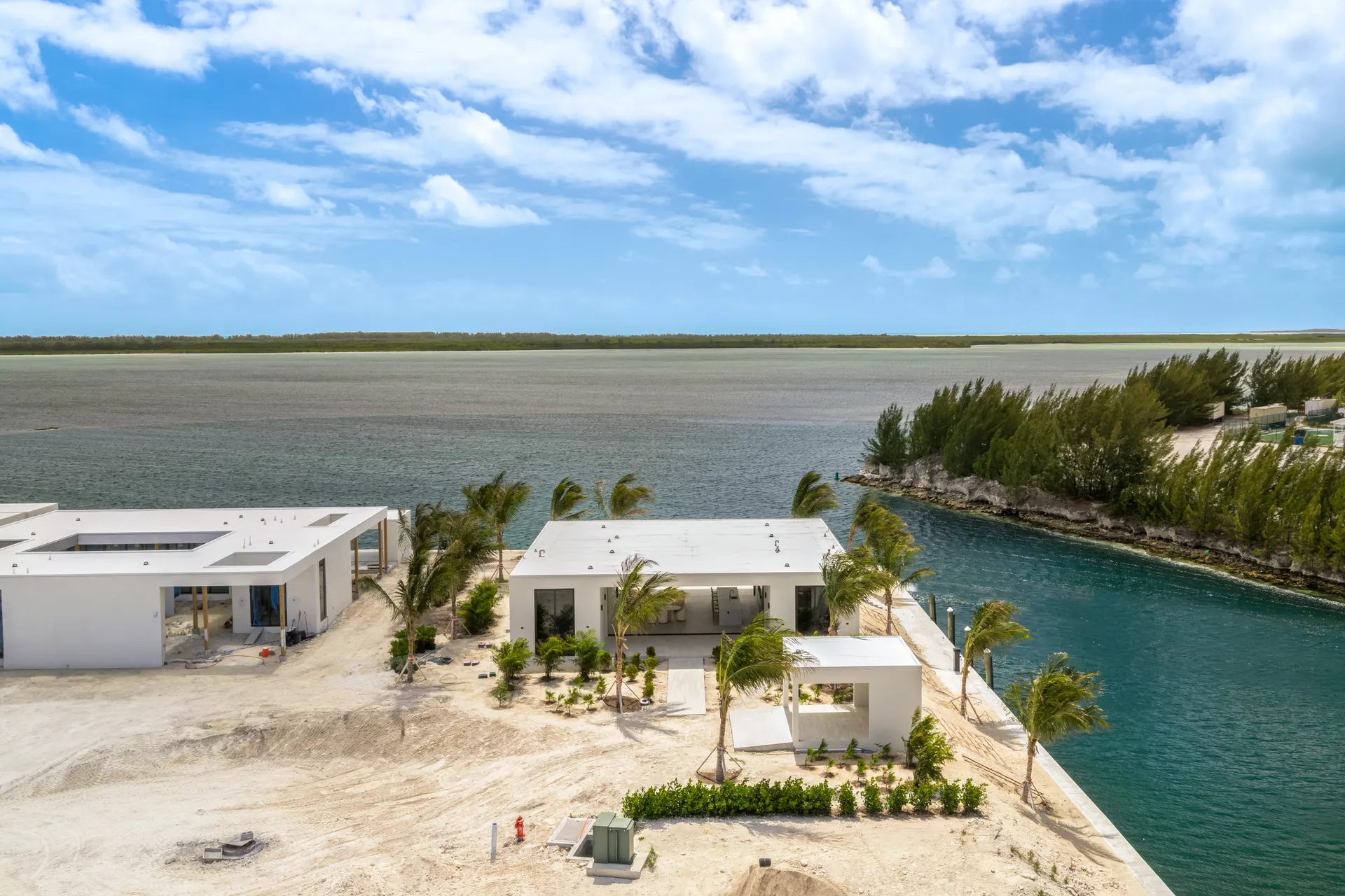Aerial of modern homes under construction on a canal